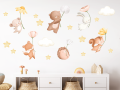 Naklejki ścienne dla dzieci z leśnymi zwierzątkami trzymającymi kwiatki, aplikowane na białej ścianie nad komodą w pokoju dziecięcym..png